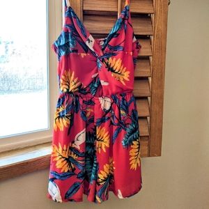 Red printed romper with a small cut out on the front.